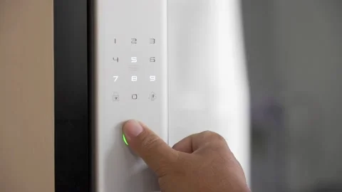 Close Up Footage of Man's hand opens the electronic digital door with a finger s Stock Footage 217657596