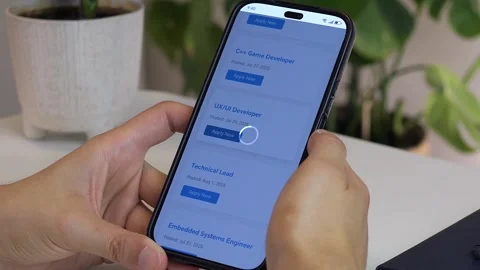 Close-up footage of a mans hands navigating a job search website on his Stock-Footage 314827505