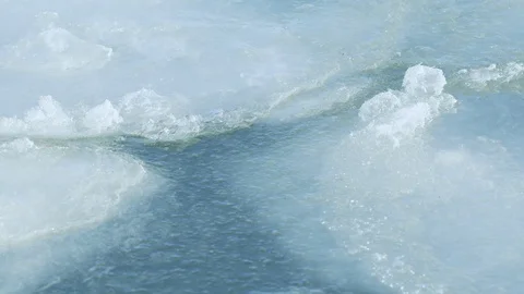 Close up footage melting thin sheets of ice flow grind 스톡 동영상 123789074