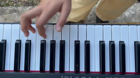 Close-up footage of a musician's hands skillfully playing an electronic keyboard Stock Footage 291552147