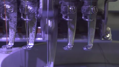 Close-up footage of needle of embroidery machine of Garment Manufacturers Stock Footage 114982575
