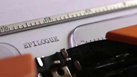 Close up footage of an old typewriter and a person writing EPILOGUE on it Stock Footage 76054983