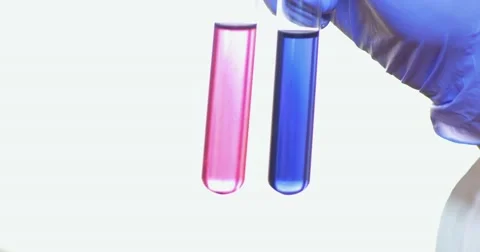 Close up footage person shaking two test tubes in a laboratory Stock Footage 48982367