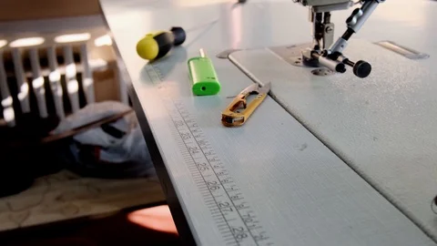 Close-up footage of professional sewing machine on manufacture Stock Footage 125478607
