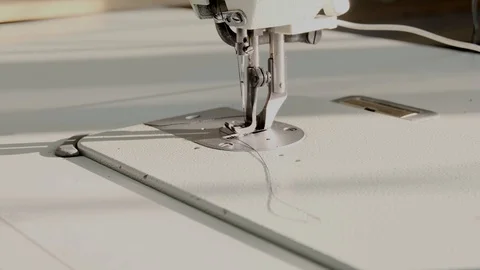 Close-up footage of professional sewing machine on manufacture Stock Footage 125478663