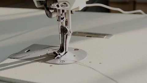 Close-up footage of professional sewing machine on manufacture Stock Footage 125478673