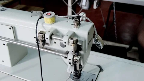 Close-up footage of professional sewing machine on manufacture Stock Footage 125478677