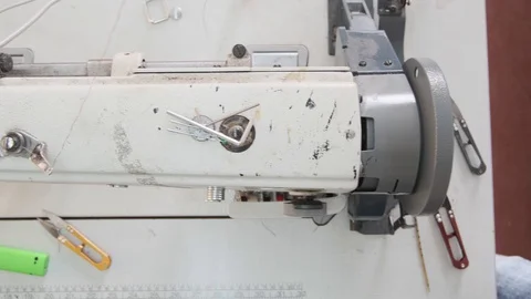 Close-up footage of professional sewing machine on manufacture Stock Footage 125478759