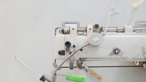 Close-up footage of professional sewing machine on manufacture Stock Footage 125478765