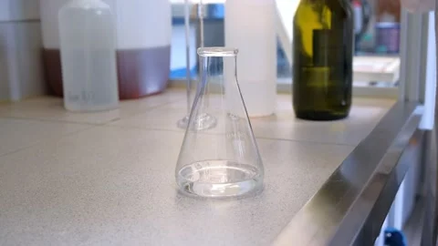 Close-up footage of a scientist adding liquid to test-tubes with a micro pipette Stock Footage 171935840