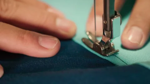 Close-up footage of a sewing machine needle and presser foot actively stitc.. Stock-Footage 342492072