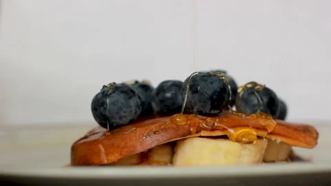 Close up footage showing Stack of tasty delicious pancake with blue berries 스톡 동영상 155523731