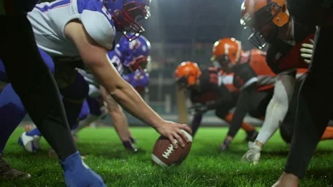 Close up footage in slowmotion. Two teams of american football players ready to Stock Footage 76605824