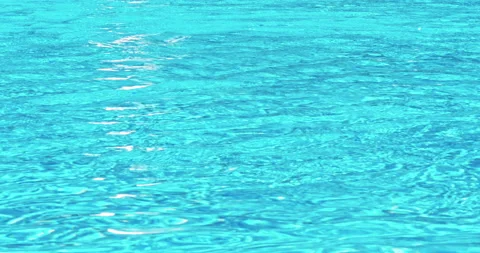 Close-up footage of small waves on blue pool surface Stock Footage 140301655