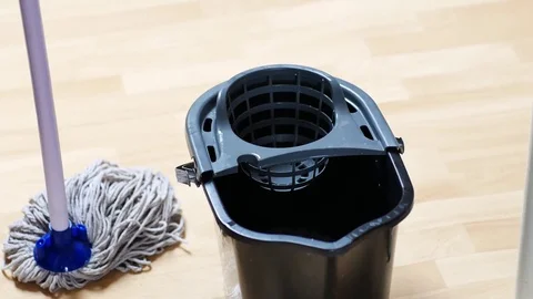 Close up footage of someone mopping the kitchen floor Stock Footage 72786049