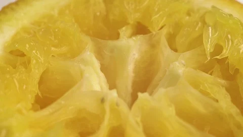 Close up footage of squeezed orange. We drank the juice from the fruit and left Stock Footage 126258962