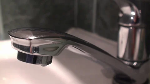 Close-Up Footage Of A Tap Opens And Water Starts To Flow In A Sink 動画素材 35828045