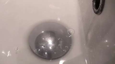 Close-Up Footage Of A Tap Opens And Water Starts To Flow In A Sink Stock Footage 35828119
