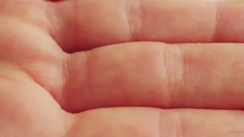 Close up footage texture of human skin, lines on the palm of the hand. Stock Footage 313961633