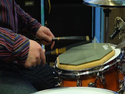 Close up footage of two drum sticks hitting a snare drum Stock Footage 73836795