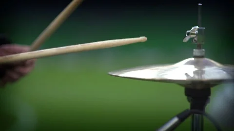 Close up footage of two drum sticks hitting a drum plates Stock Footage 83406899
