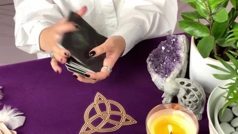 Close up footage of two hands shuffling and adjusting tarot cards Stock Footage 168326900