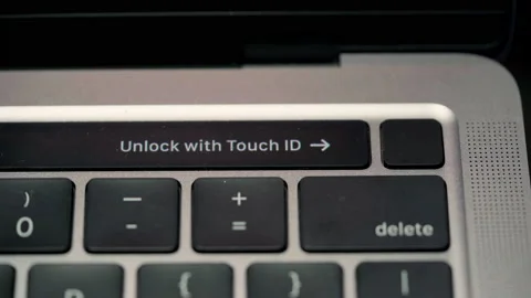 Close up footage of unlock with touch id animation text guide display on Stock Footage 219811617