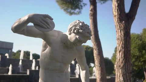 A close-up footage of white statue in the background of decorative fountain. Video stock 133525098