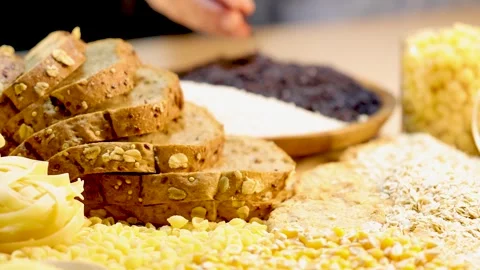 Close-up footage of whole grain bread slices and various grains like rice a.. Stock Footage 333936218