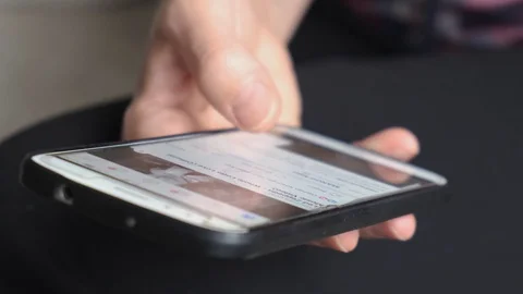 Close up footage of woman using mobile phone and checking social media accounts. Stock Footage