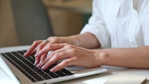 Close up footage of woman's hands typing on laptop keyboard. Study and work  Stock Footage 302155754
