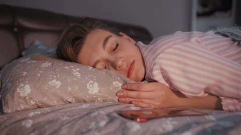 Close-up footage of young pleasant-looking Ukrainian woman sleeping in bed. Shot Stock Footage 112751785