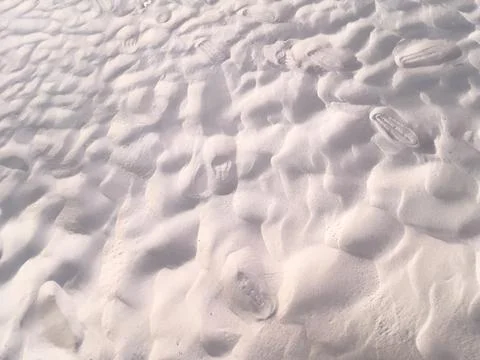 Close-up of Footprints in Sand Фото