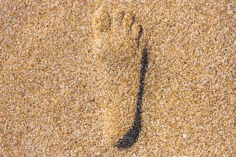 Close up of footstep in sandy on the beach Stock Photos