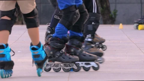 Close up of the footwork of children practicing roller skating . Stock Footage 278282681