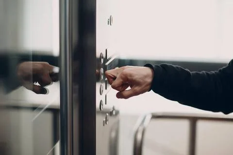 Close up of forefinger bone pressing the button elevator during coronaviru... Foto stock