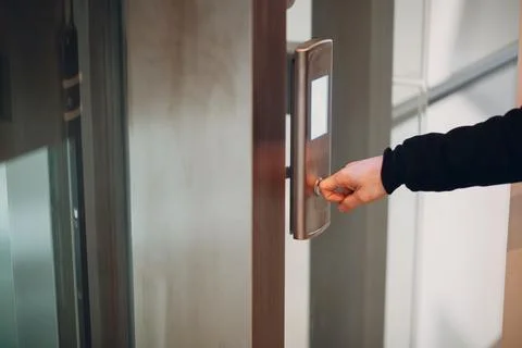 Close up of forefinger pressing the button elevator during coronavirus pandemic Stock Photos
