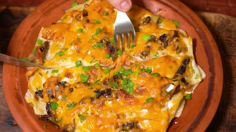 Close up of a fork cutting a beautiful piece of a lasagna Stock Footage 248985519