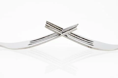 Close up of fork isolated over white background with a little shadow Stock Photos