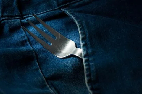 Close up fork in jeans' pocket Stock Photos
