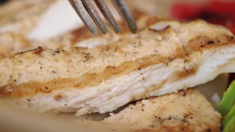 Close-up of a Fork Lifting a Piece of Grilled Chicken 스톡 동영상 344234785