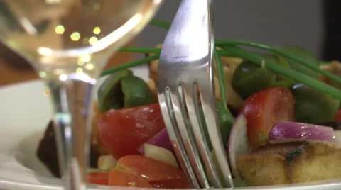 Close up of fork picking food from a salad  Stock Footage 47966396