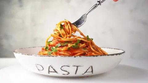 Close up of a fork taking spaghetti with tomato sauce from the plate Stock Footage 139275529