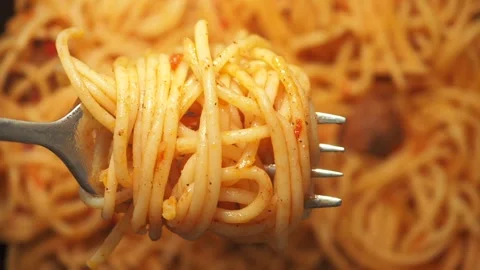 Close up of fork twirling spaghetti with tomato sauce in slow motion food p.. Stock-Footage 333029886