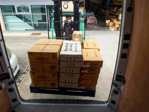 Close-up of Forklift driver loading van. Editorial use only. Stock Photos