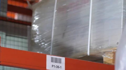 Close-up, forklift to put a pallet on the shelf. 4K Slow Mo Stock Footage 111766460