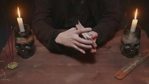 Close up of fortune teller tarot reader shuffle the cards and prepare them to Video stock 145683164