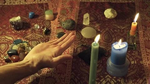 Close-up of a fortune-teller's pendulum reading the future in one hand. Stock Footage 259143637