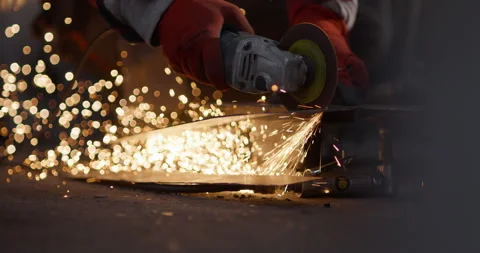 Close up of Foundry Worker Cutting Metal Stock Footage 329530650