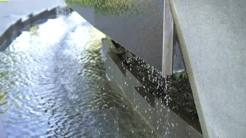 Close-up of the fountain flowing down the panel. Fountain in a public park Stock Footage 201070836